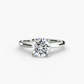 Solitaire ring in white gold with a round centre stone