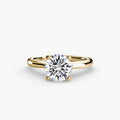 Solitaire ring in yellow gold with a round centre stone