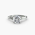 Solitaire ring in white gold with a round centre stone