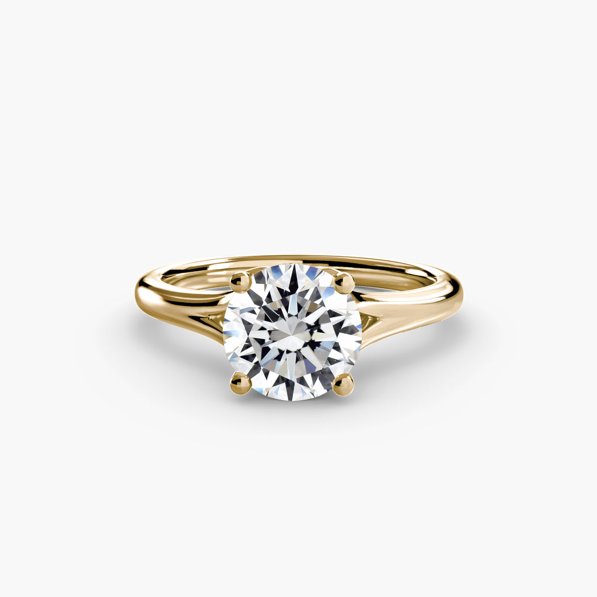 Solitaire ring in yellow gold with a round centre stone
