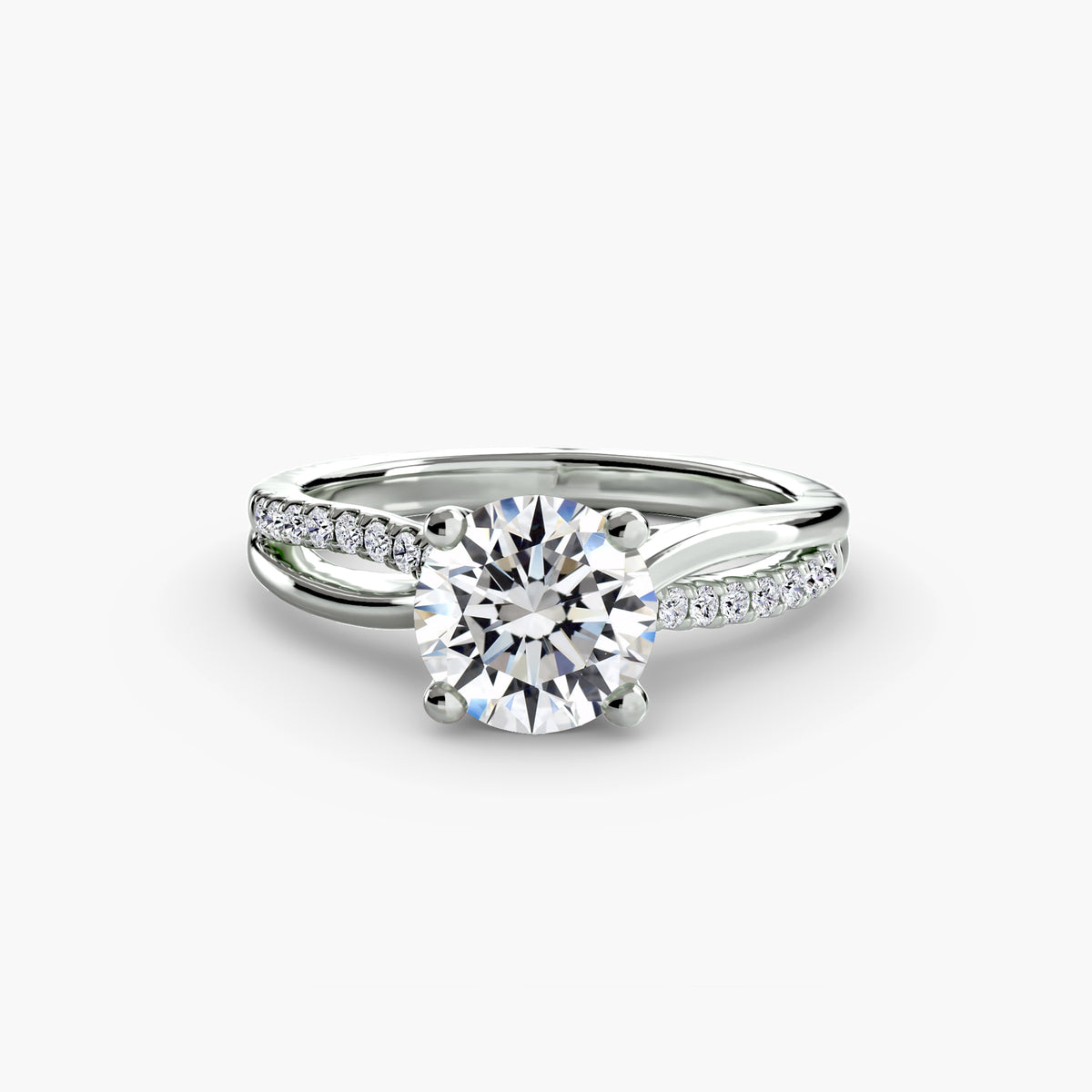 The Split Shank Pavé Solitaire engagement ring in white gold with a round centre stone