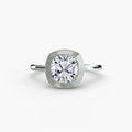 The Bezel Set Solitaire engagement ring in white gold with a cushion-cut centre stone