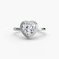 The Bezel Set Solitaire engagement ring in white gold with a heart-shaped centre stone
