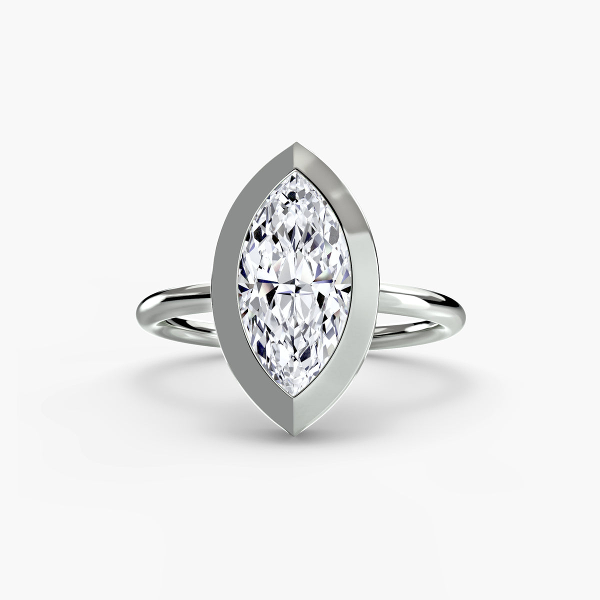 The Bezel Set Solitaire engagement ring in white gold with a marquise centre stone