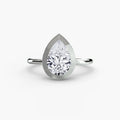 The Bezel Set Solitaire engagement ring in white gold with a pear-shaped centre stone