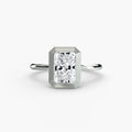 The Bezel Set Solitaire engagement ring in white gold with a radiant-cut centre stone