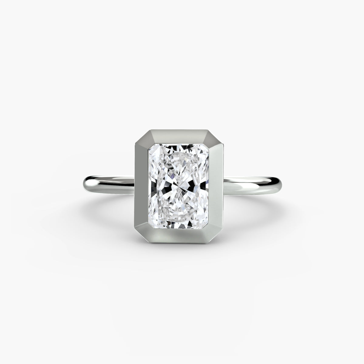 The Bezel Set Solitaire engagement ring in white gold with a radiant-cut centre stone