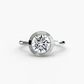 The Bezel Set Solitaire engagement ring in white gold with a round centre stone