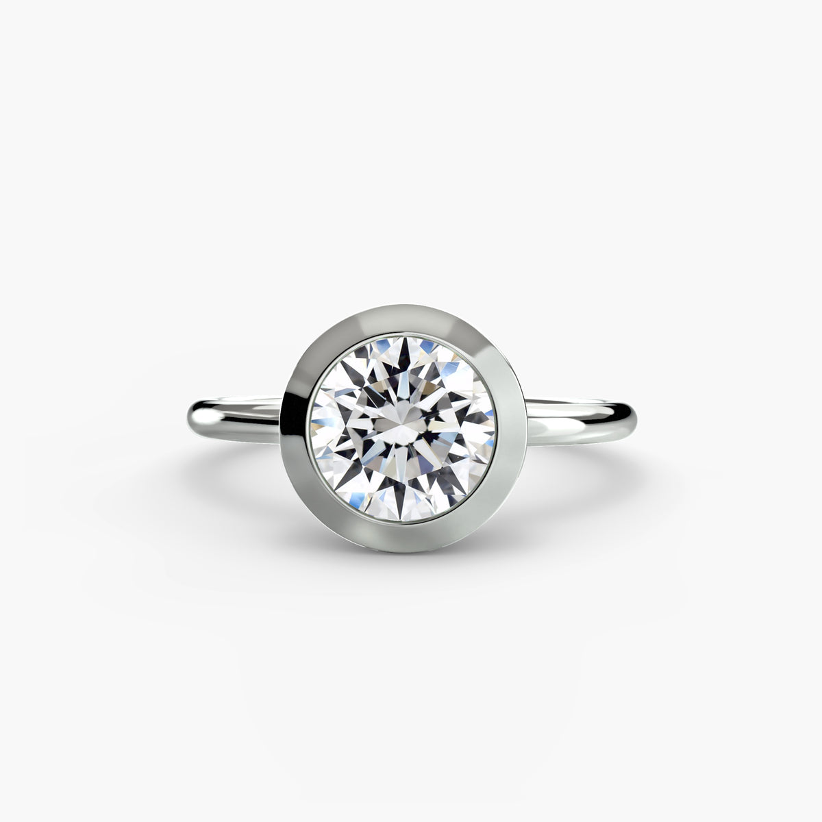 The Bezel Set Solitaire engagement ring in white gold with a round centre stone
