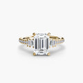 Solitaire with Pavé engagement ring in yellow gold with an emerald-cut centre stone