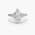 Solitaire with Pavé engagement ring in white gold with a marquise centre stone