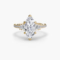 Solitaire with Pavé engagement ring in yellow gold with a marquise centre stone
