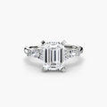 The Floral Accent Solitaire engagement ring in white gold with an emerald-cut centre stone