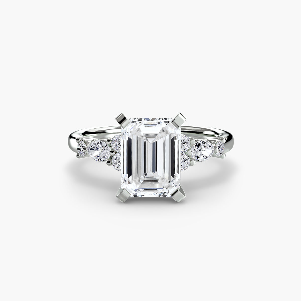 The Floral Accent Solitaire engagement ring in white gold with an emerald-cut centre stone