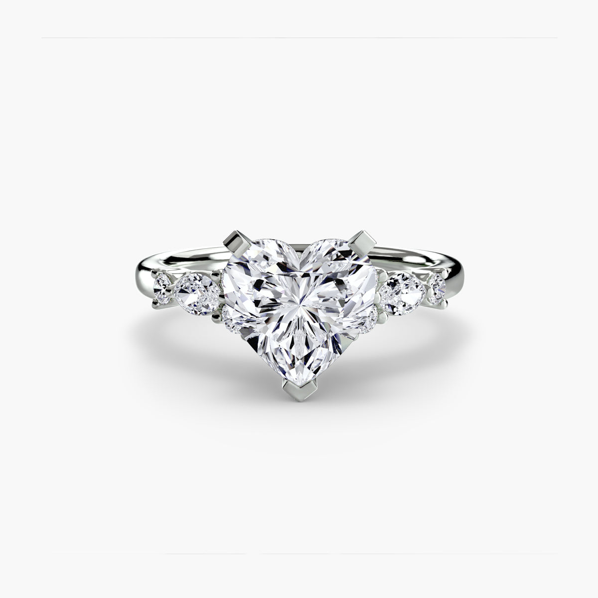 The Floral Accent Solitaire engagement ring in white gold with a heart-shaped centre stone