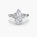 The Floral Accent Solitaire engagement ring in white gold with a marquise centre stone