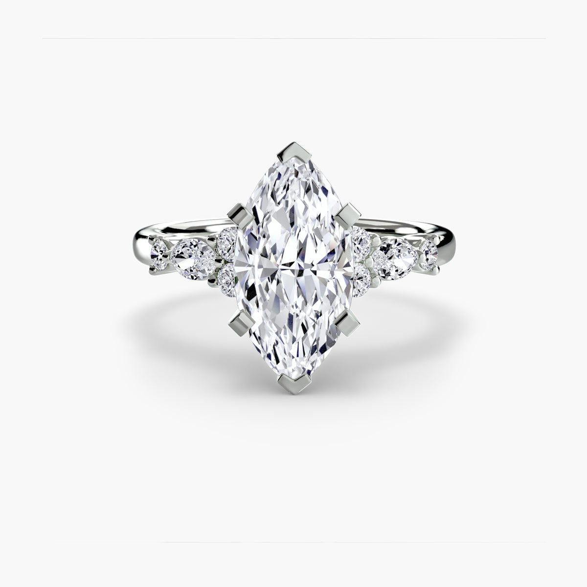 The Floral Accent Solitaire engagement ring in white gold with a marquise centre stone