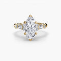 The Floral Accent Solitaire engagement ring in yellow gold with a marquise centre stone