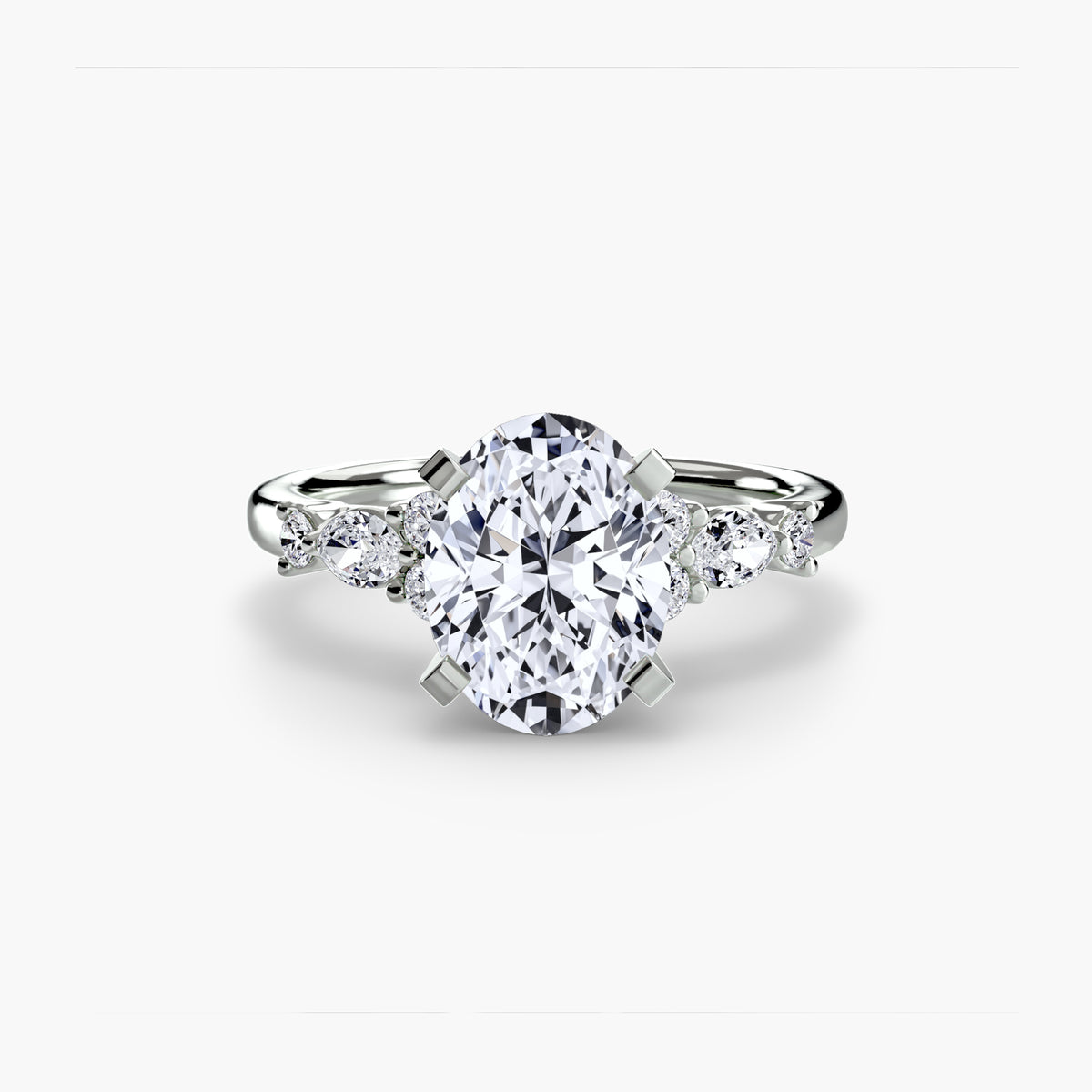 The Floral Accent Solitaire engagement ring in white gold with an oval centre stone