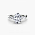 The Floral Accent Solitaire engagement ring in white gold with an oval centre stone