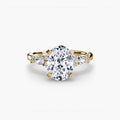 The Floral Accent Solitaire engagement ring in yellow gold with an oval centre stone