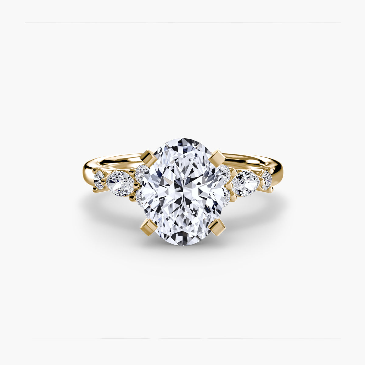 The Floral Accent Solitaire engagement ring in yellow gold with an oval centre stone