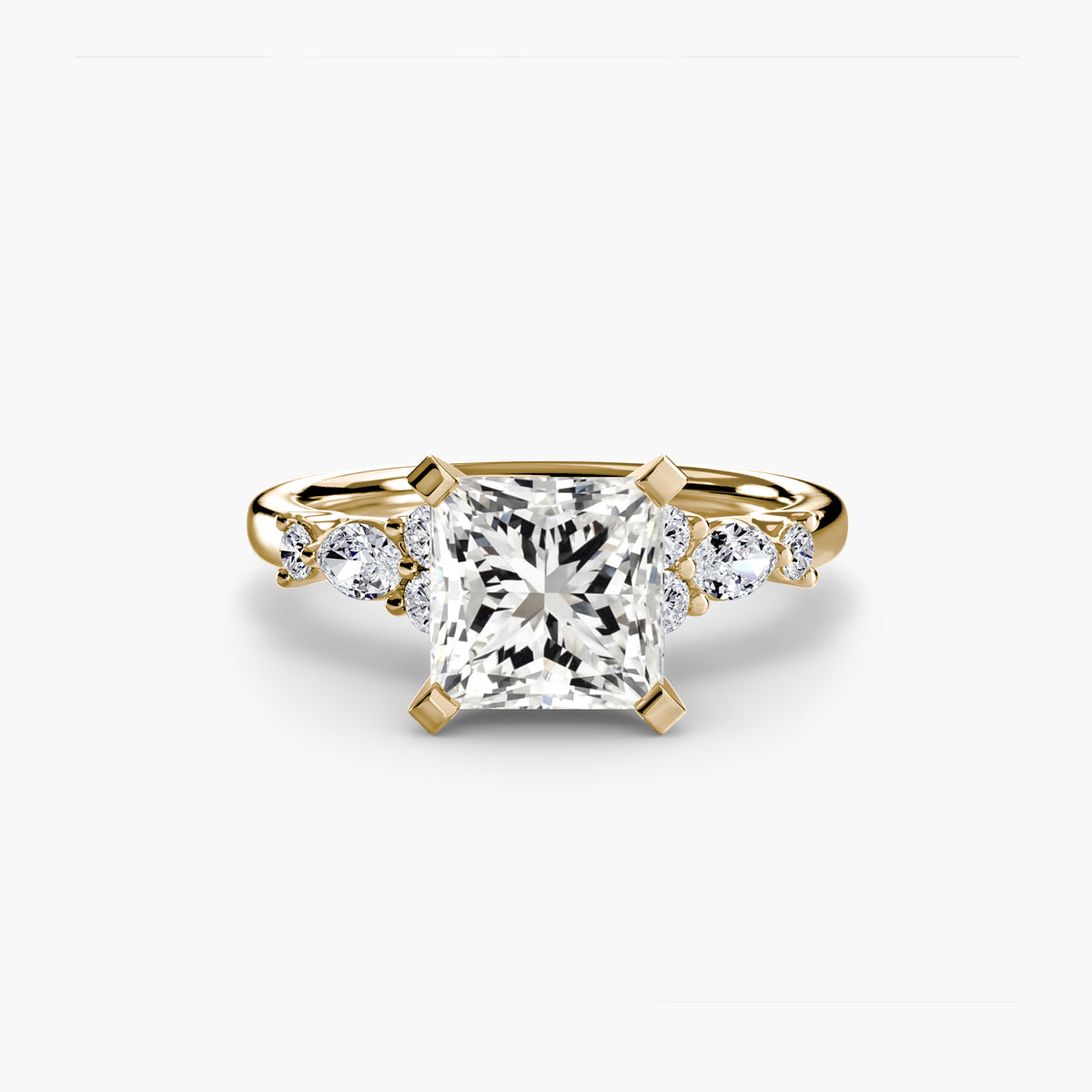 The Floral Accent Solitaire engagement ring in yellow gold with a princess-cut centre stone