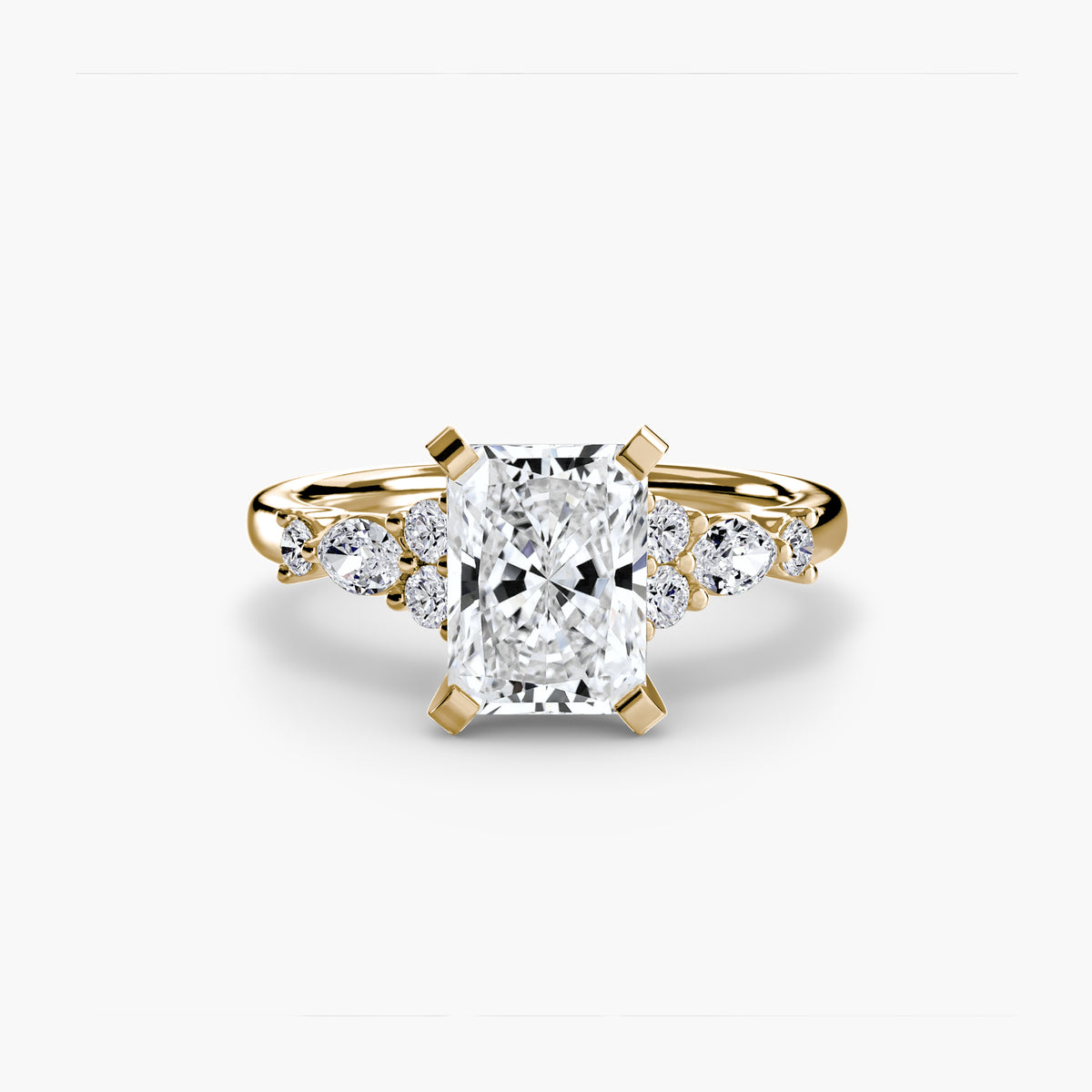The Floral Accent Solitaire engagement ring in yellow gold with a radiant-cut centre stone