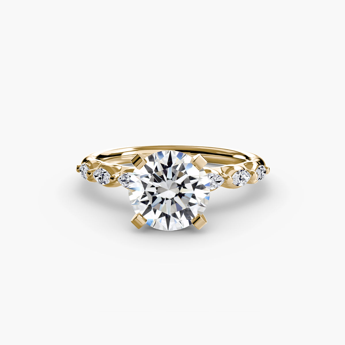 The Floral Accent Solitaire engagement ring in yellow gold with a round centre stone