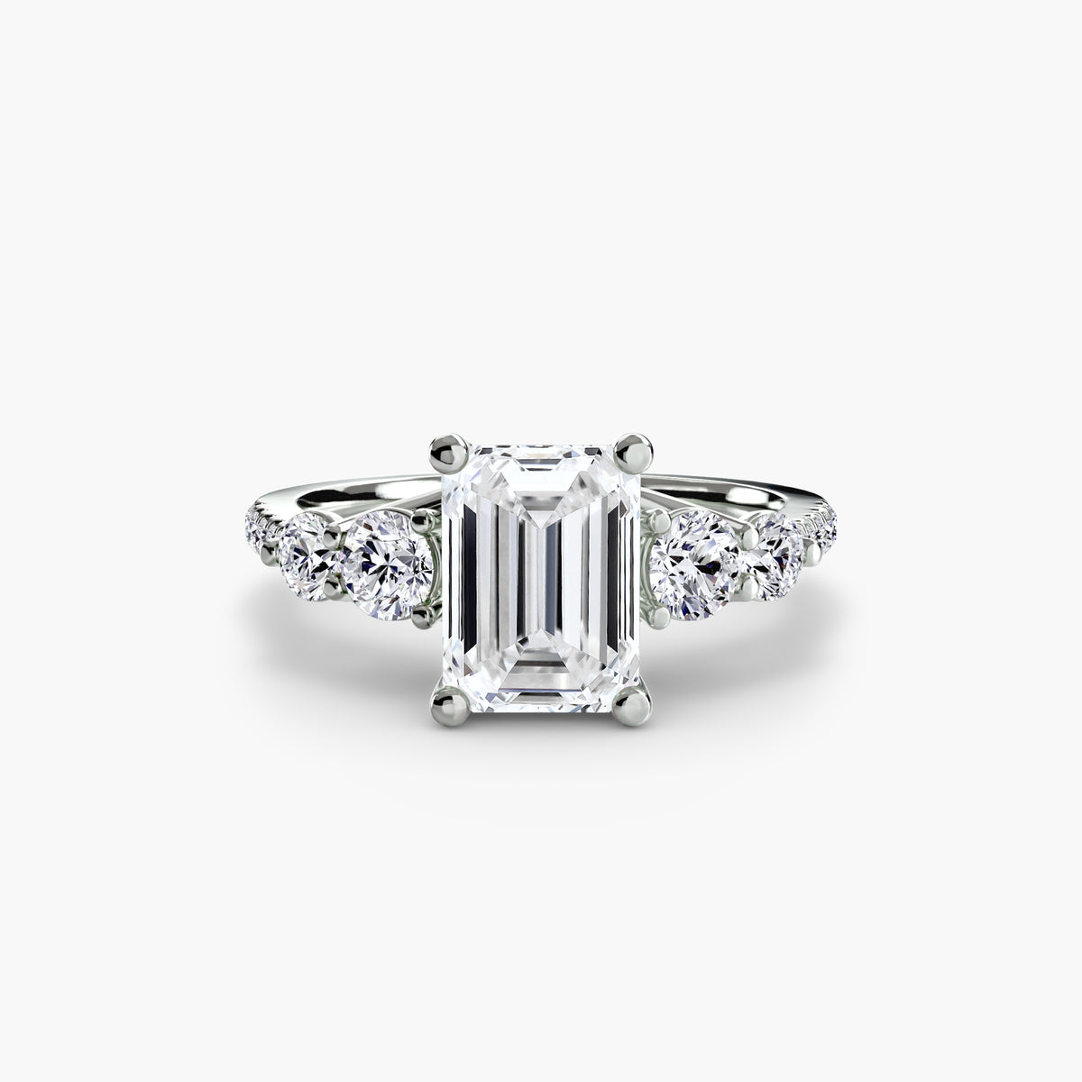 Five Stone Ring with Pavé Band in white gold with an emerald-cut centre stone