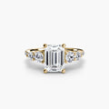 Five Stone Ring with Pavé Band in yellow gold with an emerald-cut centre stone