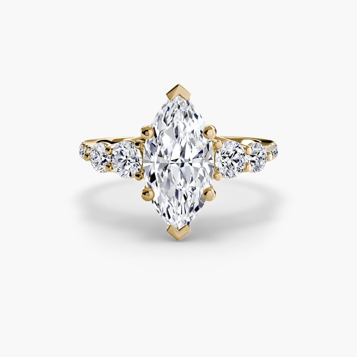 Five Stone Ring with Pavé Band in yellow gold with a marquise centre stone