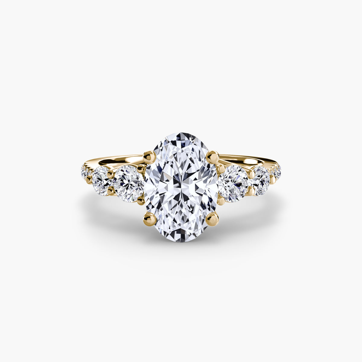 Five Stone Ring with Pavé Band in yellow gold with an oval centre stone
