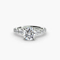 The Cascade Diamond Ring in white gold with a round centre stone