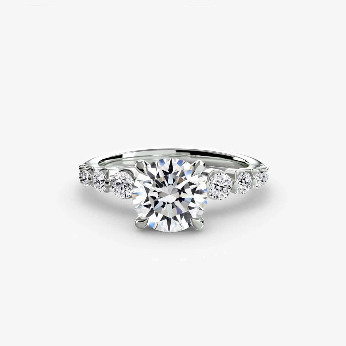 The Cascade Diamond Ring in white gold with a round centre stone