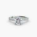 Solitaire with Pavé engagement ring in white gold with a round centre stone