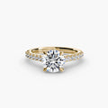 Solitaire with Pavé engagement ring in yellow gold with a round centre stone