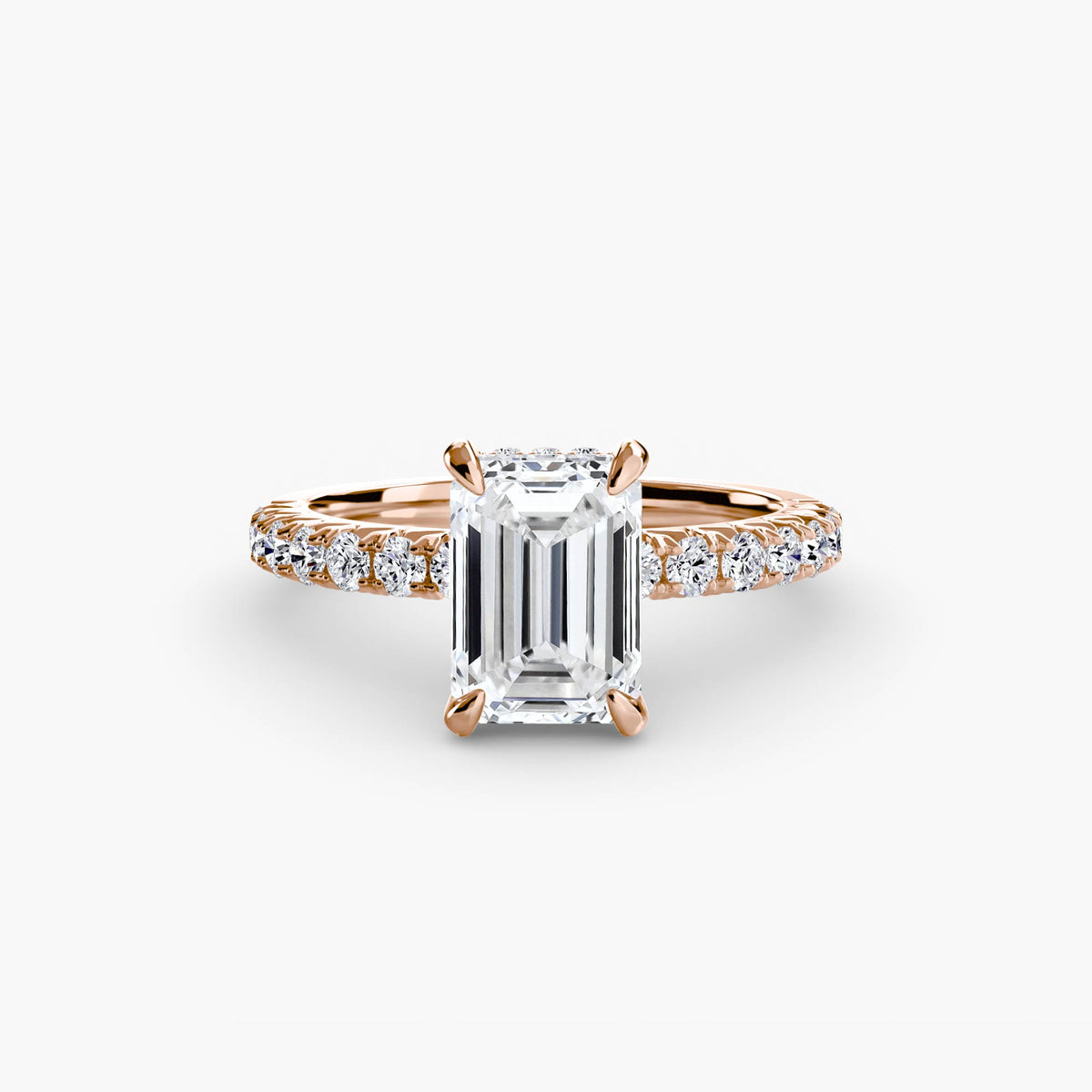 Solitaire with Pavé engagement ring in rose gold with an emerald-cut centre stone