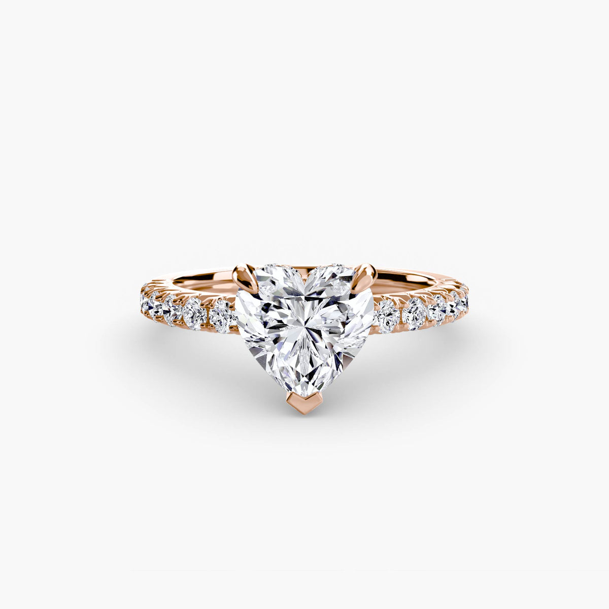 Solitaire with Pavé engagement ring in rose gold with a heart-shaped centre stone