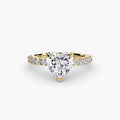 Solitaire with Pavé engagement ring in yellow gold with a heart-shaped centre stone