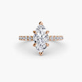 Solitaire with Pavé engagement ring in rose gold with a marquise centre stone