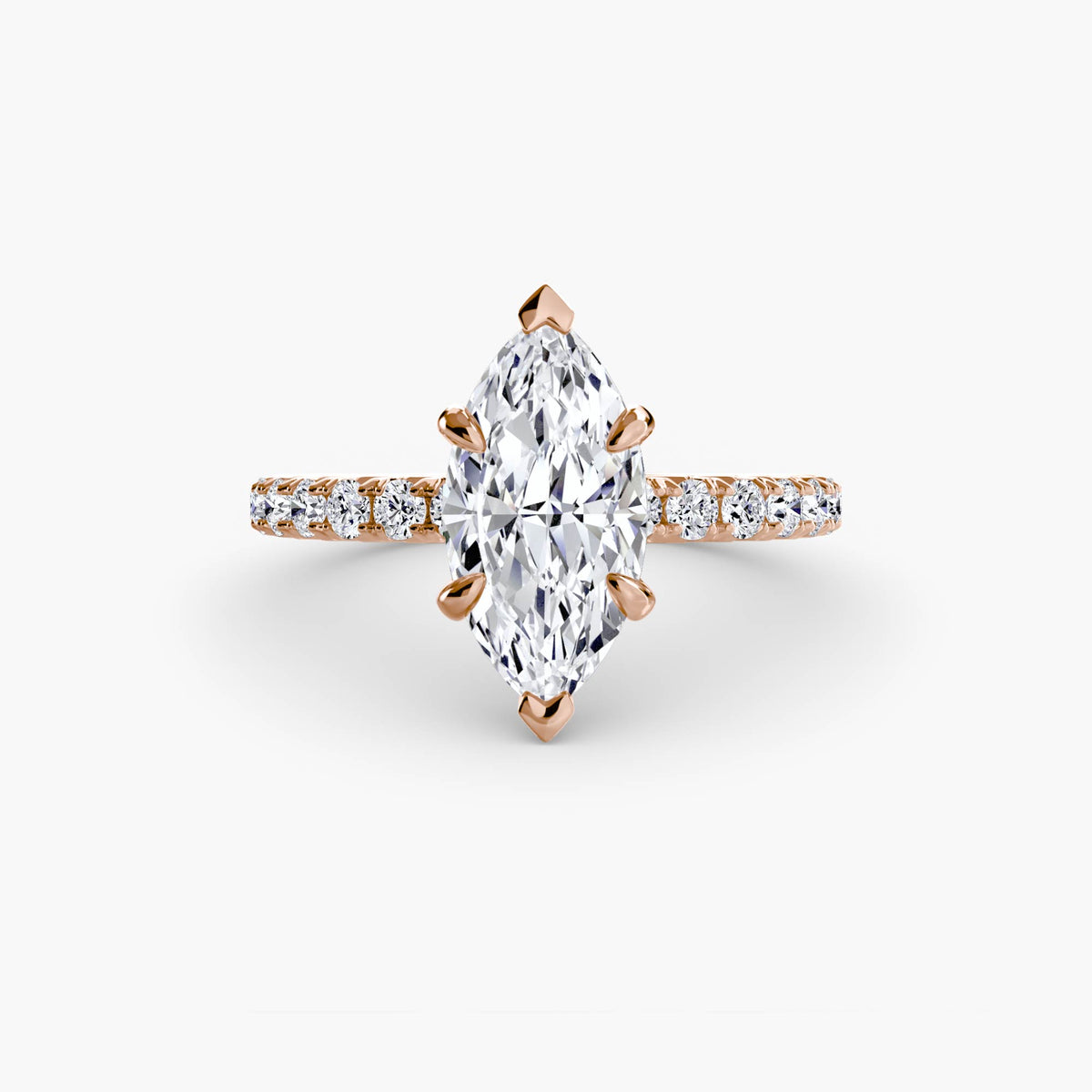 Solitaire with Pavé engagement ring in rose gold with a marquise centre stone