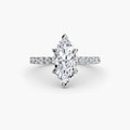 Solitaire with Pavé engagement ring in white gold with a marquise centre stone
