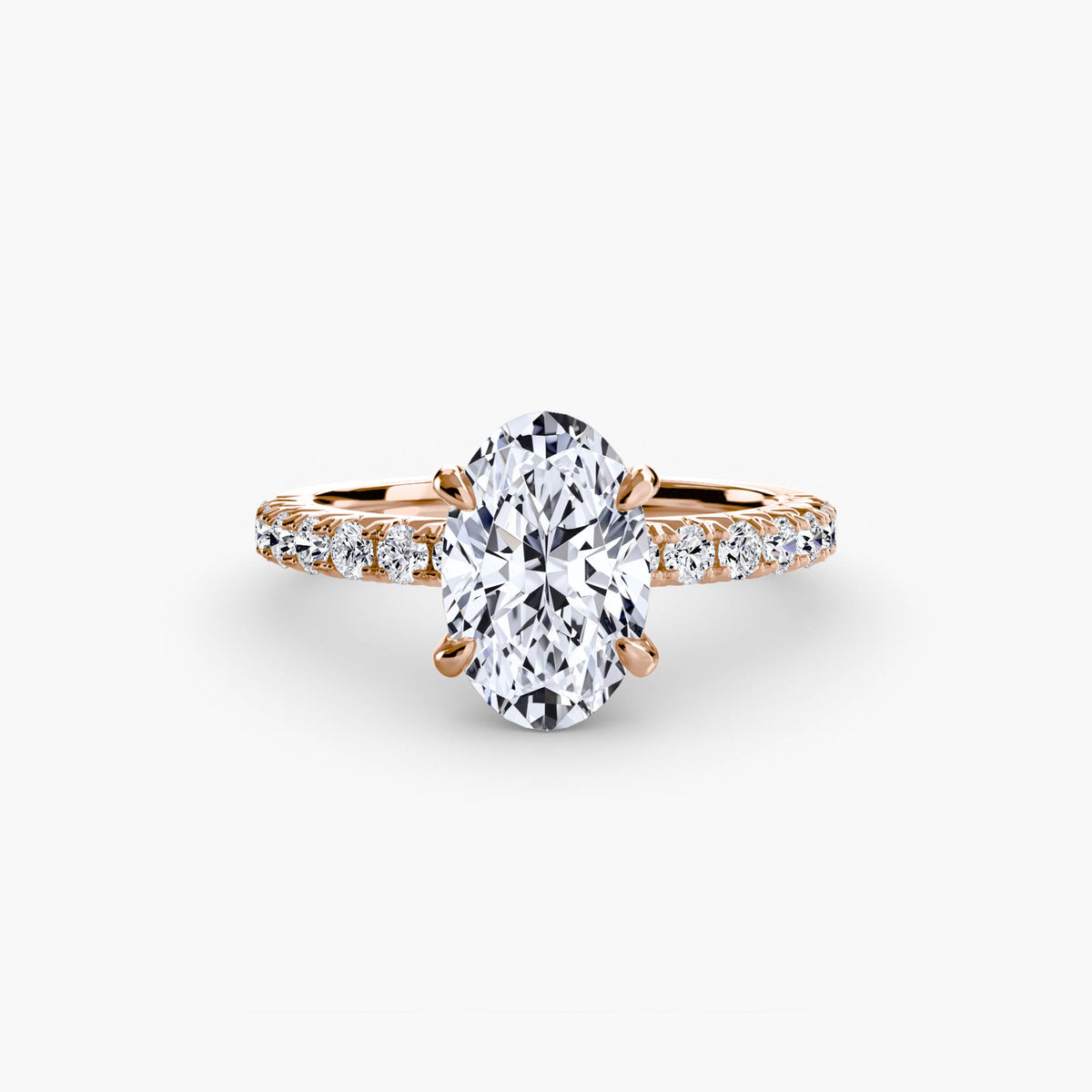 Solitaire with Pavé engagement ring in rose gold with an oval centre stone
