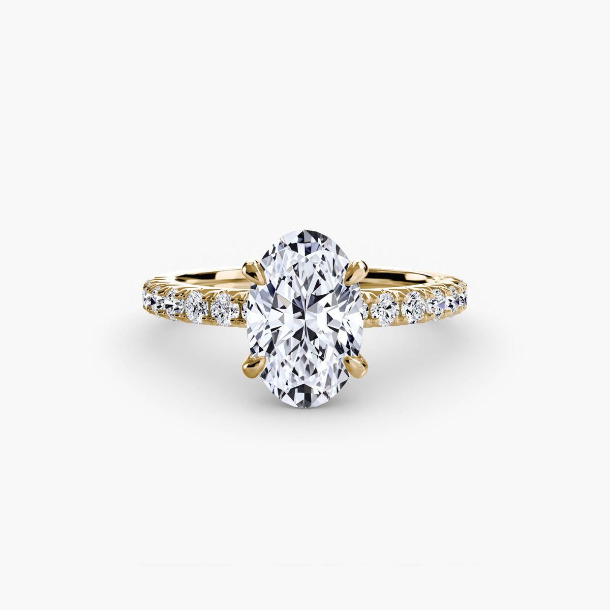 Solitaire with Pavé engagement ring in yellow gold with an oval centre stone