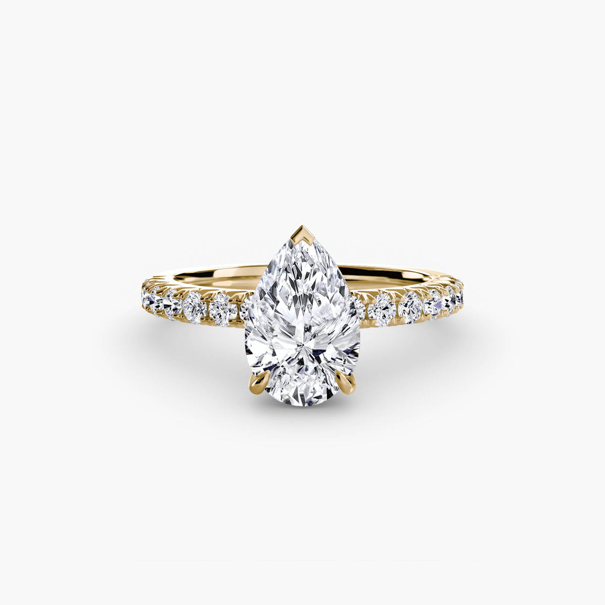 Solitaire with Pavé engagement ring in yellow gold with a pear-shaped centre stone