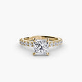 Solitaire with Pavé engagement ring in yellow gold with a princess-cut centre stone
