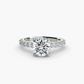 Solitaire with Pavé engagement ring in white gold