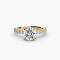 Solitaire with Pavé engagement ring in yellow gold