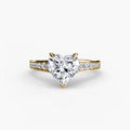Solitaire with Pavé engagement ring in yellow gold with a heart-shaped centre stone
